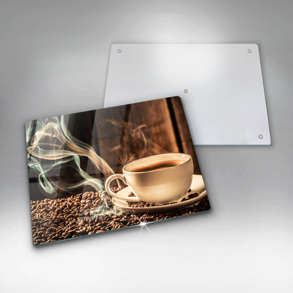 Tocător din sticlă ceașcă și boabe de cafea