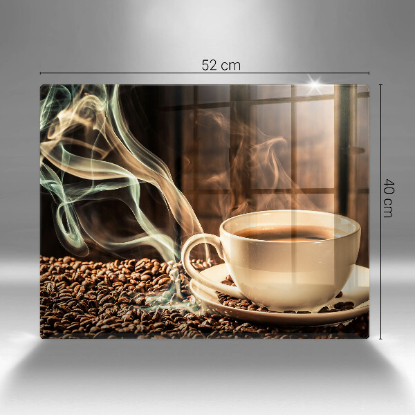 Tocător din sticlă ceașcă și boabe de cafea